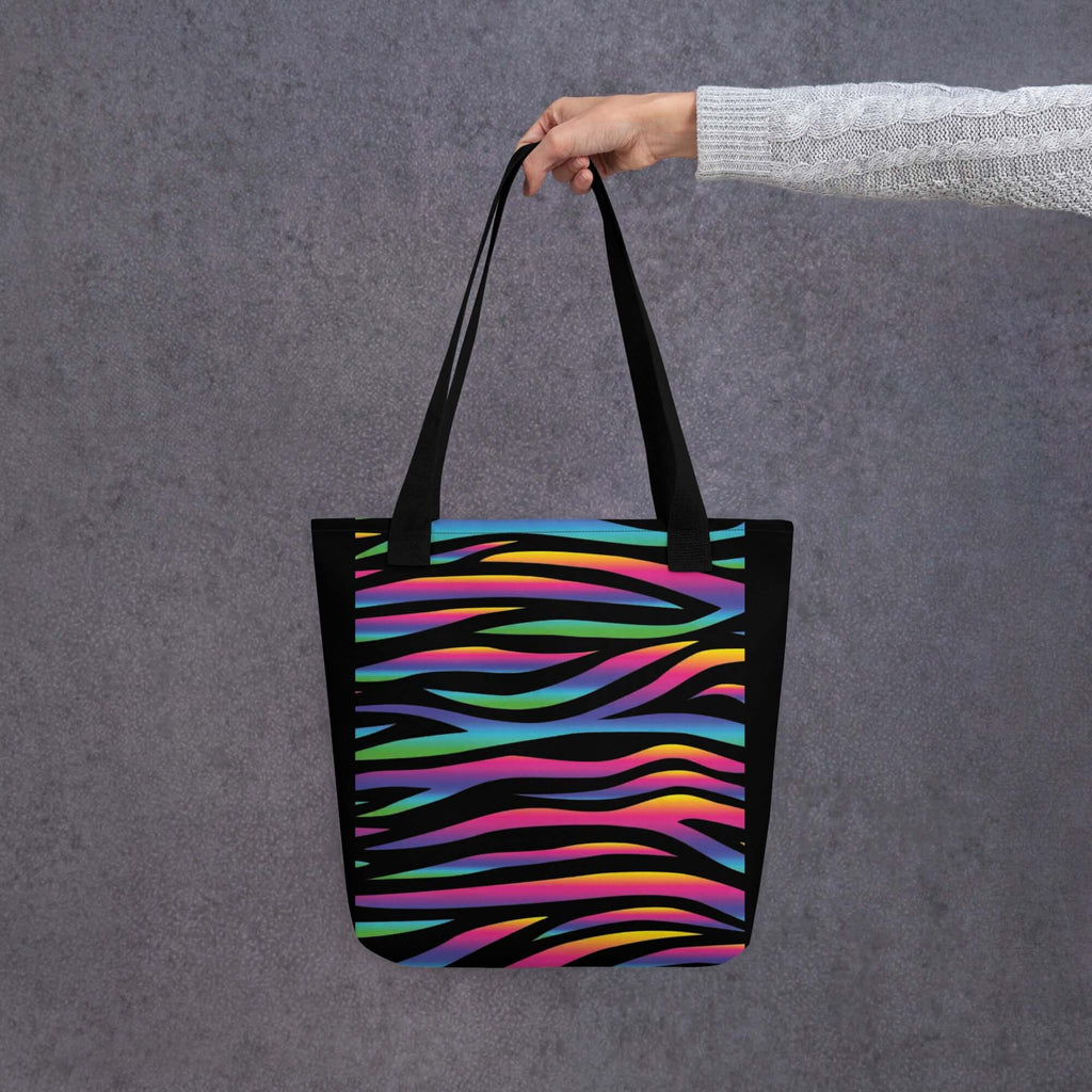 BOLSA CEBRA COLORES URBAN mostrando diseño de rayas vibrantes en una bolsa de tela unisex.